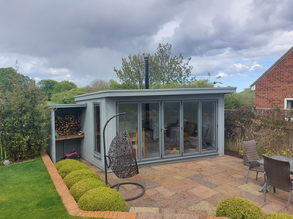 Garden room clad in Strongcore with UPVC bifold doors