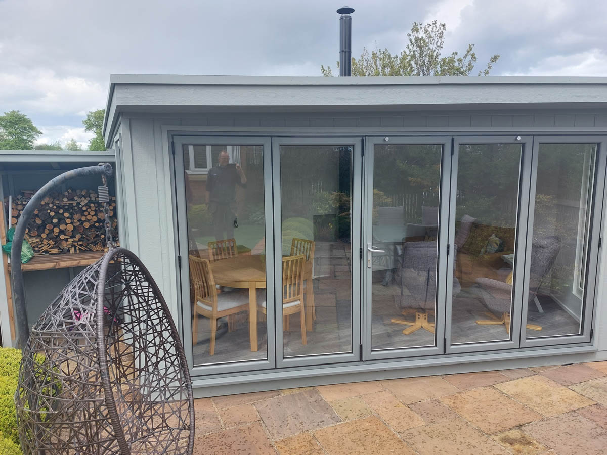 Garden room clad in Strongcore with UPVC bifold doors