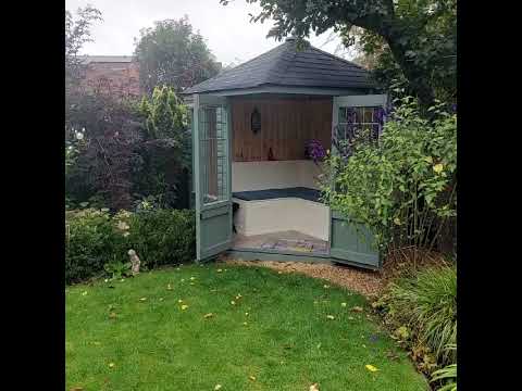 Customer shows us his corner summerhouse with bench seat and storage.